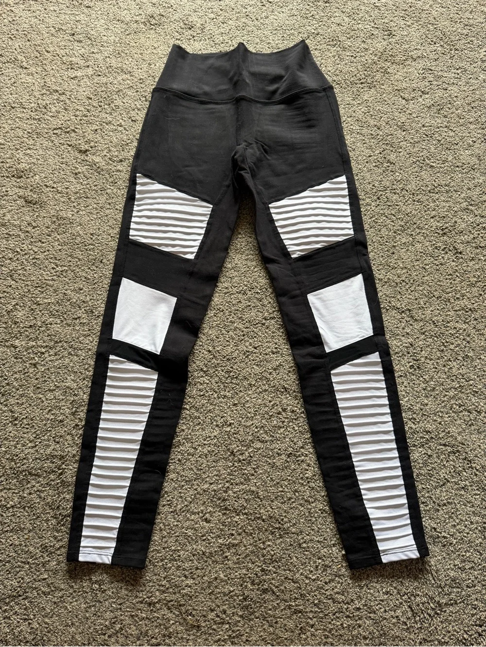 ALO Yoga Moto Leggings in a black and white